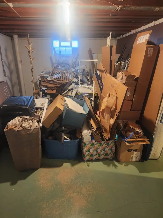 Roll-off dumpster container at job site for Cleanout Dumpster Rental in Garden City